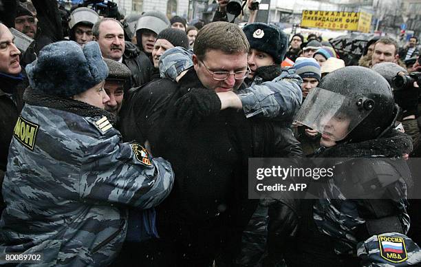 Russian riot police detain opposition politician Nikita Belykh , the head of the opposition Union of Right Forces party during a rally of the Other...