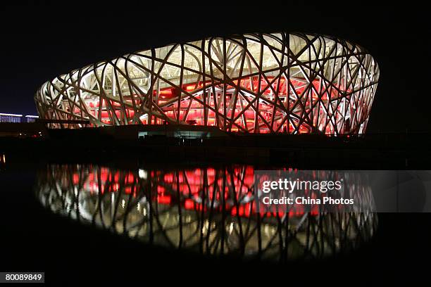 View of the illuminated National Stadium, dubbed the 'Bird's Nest' during the trial illumination of the project on March 3, 2008 in Beijing, China....