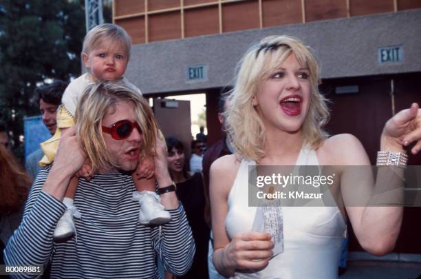 Kurt Cobain of Nirvana with wife Courtney Love and daughter Frances Bean Cobain