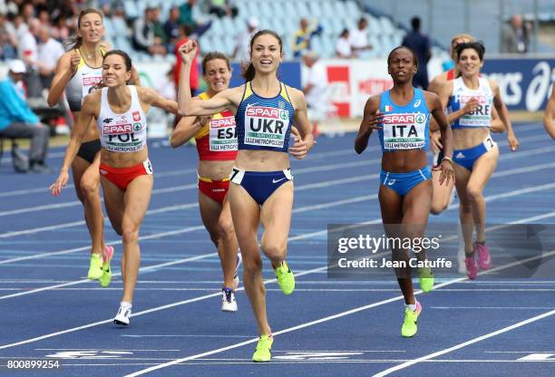 Olha Lyakhova of Ukraine celebrates winning the 800m in front of Joanna Jozwik of Poland , Yusneysie Santiusti of Italy during day 2 of the 2017...