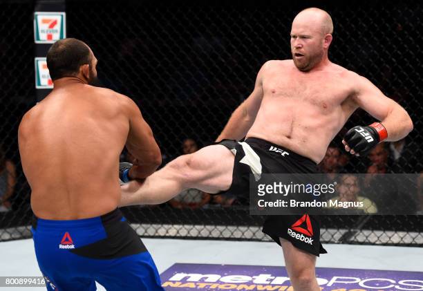 Tim Boetsch kicks Johny Hendricks in their middleweight bout during the UFC Fight Night event at the Chesapeake Energy Arena on June 25, 2017 in...