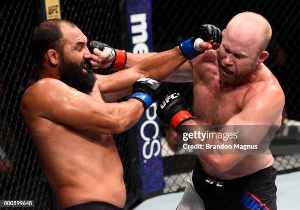 Tim Boetsch and Johny Hendricks trade punches in their middleweight bout during the UFC Fight Night event at the Chesapeake Energy Arena on June 25,...