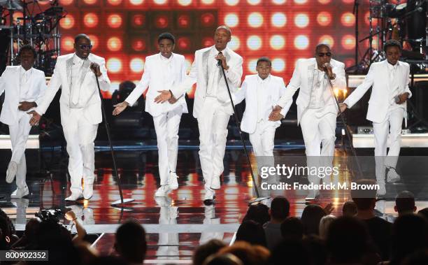 Young and adult cast members of 'The New Edition Story' and original members of New Edition perform onstage at 2017 BET Awards at Microsoft Theater...