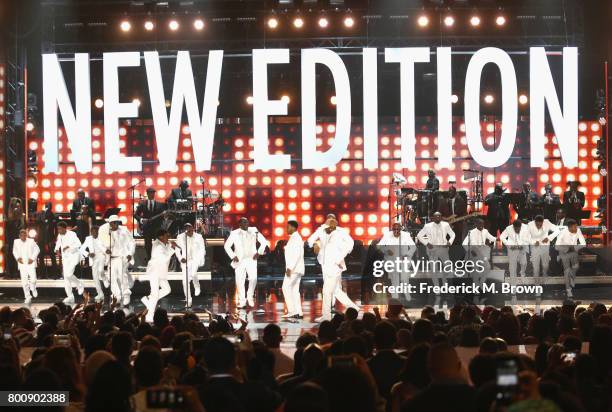 Young and adult cast members of 'The New Edition Story' and original members of New Edition perform onstage at 2017 BET Awards at Microsoft Theater...