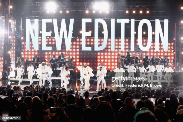 Young and adult cast members of 'The New Edition Story' and original members of New Edition perform onstage at 2017 BET Awards at Microsoft Theater...