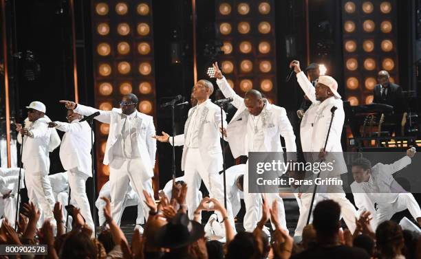 Young and adult cast members of 'The New Edition Story' and original members of New Edition perform onstage at 2017 BET Awards at Microsoft Theater...