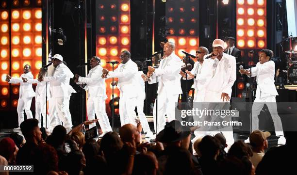 Young and adult cast members of 'The New Edition Story' and original members of New Edition perform onstage at 2017 BET Awards at Microsoft Theater...