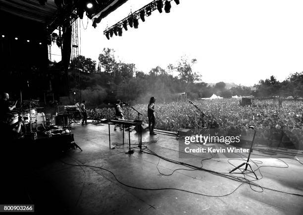 Musicians Patrick Wilson, Scott Shriner, Rivers Cuomo and Brian Bell of musical group Weezer perform on The Oak stage during Arroyo Seco Weekend at...