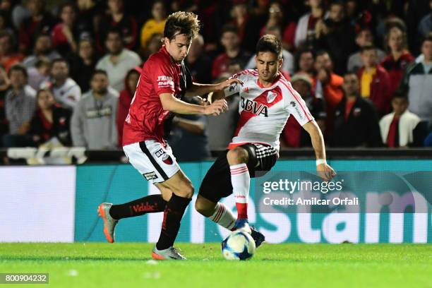 Gonzalo Martinez of River Plate fights for the ball with Cristian Bernardi of Colon during a match between Colon and River Plate as part of Torneo...