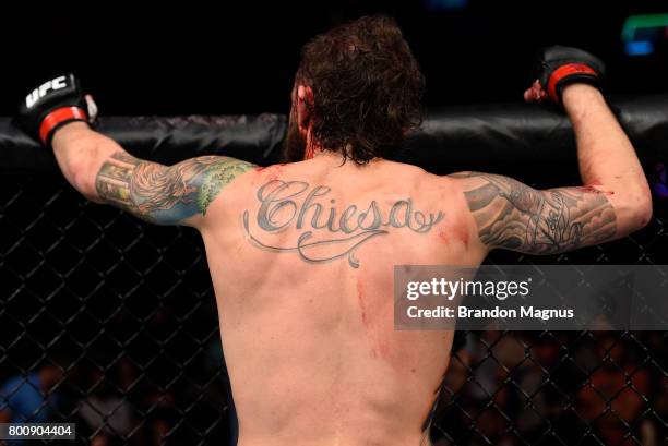 Michael Chiesa reacts after his submission loss to Kevin Lee in their lightweight bout during the UFC Fight Night event at the Chesapeake Energy...