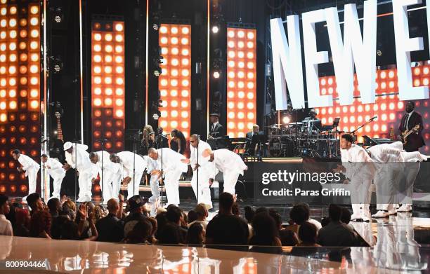 Young and adult cast members of 'The New Edition Story' and original members of New Edition perform onstage at 2017 BET Awards at Microsoft Theater...