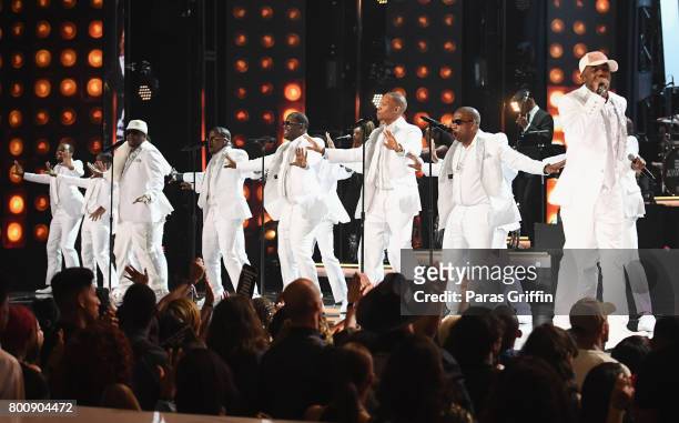 Young and adult cast members of 'The New Edition Story' and original members of New Edition perform onstage at 2017 BET Awards at Microsoft Theater...