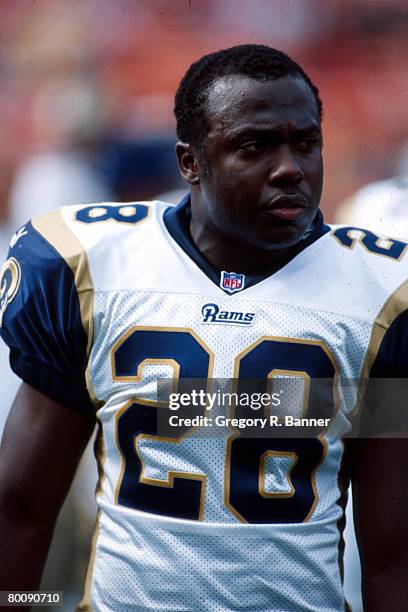 Running back Marshall Faulk of the St. Louis Rams looks on from the sideline in a 34 to 24 win over the San Francisco 49ers on . ?Gregory Banner