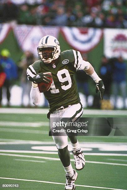 New York Jets wide receiver Keyshawn Johnson gets some open field yardage against the Jacksonville Jaguars during an AFC Divisional Playoff Game won...