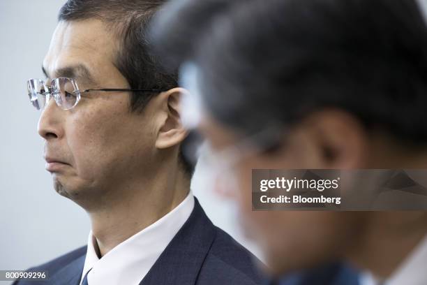Shigehisa Takada, chairman and chief executive officer of Takata Corp., left, attends a news conference in Tokyo, Japan, on Monday, June 26, 2017....