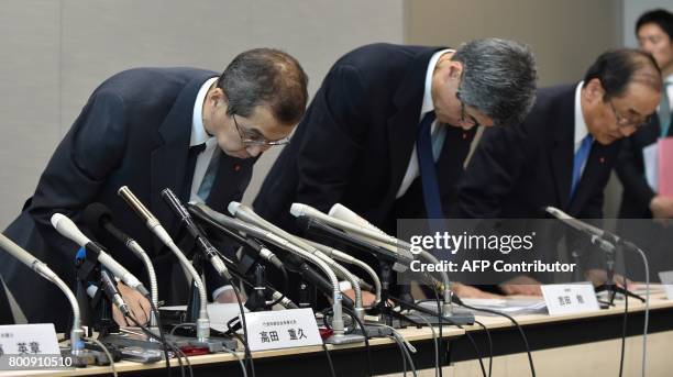 Chairman and CEO of Japanese airbag maker Takata Corp., Shigehisa Takada , bows with other executives at the end of a press conference in Tokyo on...