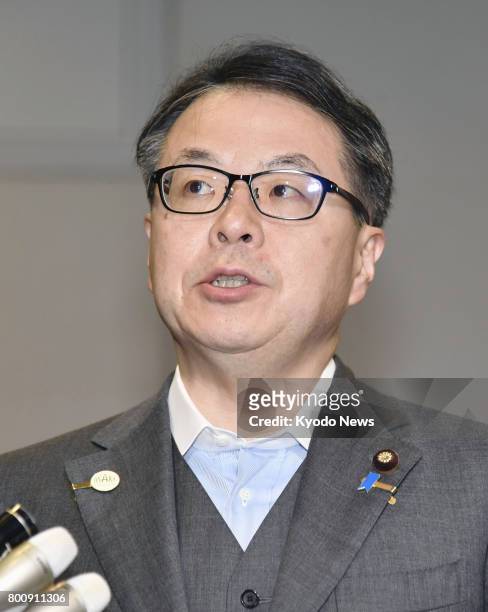 Japanese Minister of Economy, Trade and Industry Hiroshige Seko speaks to reporters in Tokyo on June 26 in response to Takata Corp.'s filing for...