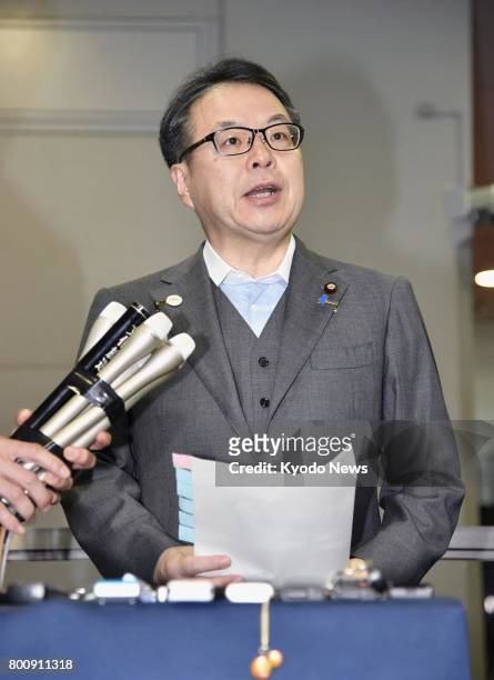 Japanese Minister of Economy, Trade and Industry Hiroshige Seko speaks to reporters in Tokyo on June 26 in response to Takata Corp.'s filing for...