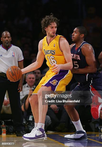 Pau Gasol of the Los Angeles Lakers drives against Al Horford of the Atlanta Hawks at Staples Center on February 19, 2008 in Los Angeles, California....