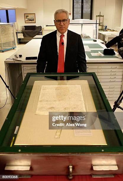 David Rubenstein, Co-founder and Managing Director of the Carlyle Group, poses for photographers during a press viewing of a 1297 version of Magna...