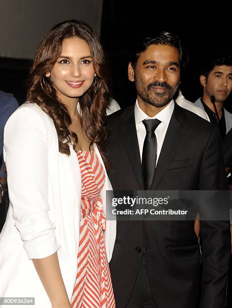 Indian Bollywood actress Huma Qureshi and Dhanush attend the trailer and music launch of the upcoming film VIP 2' in Mumbai on June 25, 2017. / AFP...