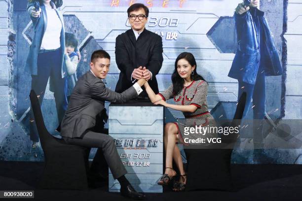 Actor Wallace Huo Chien-hwa, actor Jackie Chan and actress Yang Mi attend the premiere of South Korean director Chang Yoon Hong-seung's film 'Reset'...