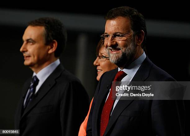 Opposition Popular Party leader Mariano Rajoy smiles with Spanish Prime Minister Jose Luis Rodriguez Zapatero before taking part in their second TV...