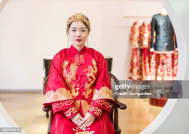 beautiful bride in chinese traditional wedding dress - silk china stock pictures, royalty-free photos & images