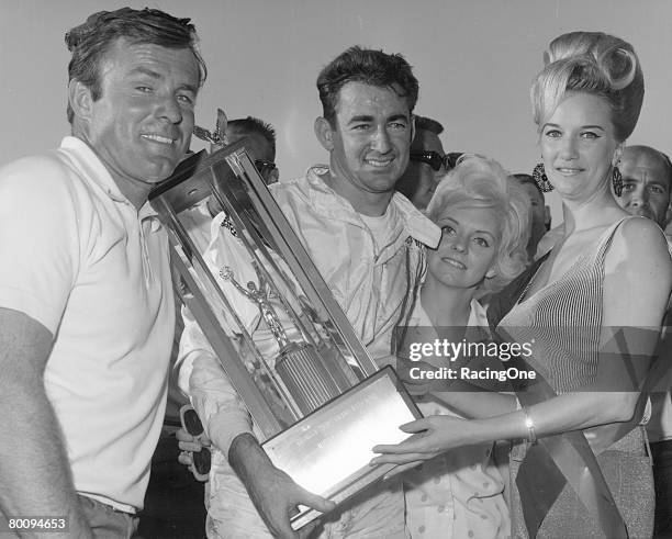 Middle Georgia Raceway, near Macon, hosted many top notch stock car events on its half-mile, paved surface. Here Bobby Allison and wife Judy enjoy a...