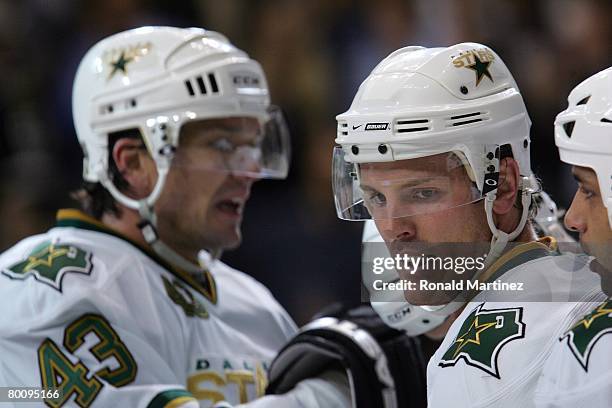 Brad Richards of the Dallas Stars celebrates with teammates during a break in NHL game action against the Chicago Blackhawks at the American Airlines...