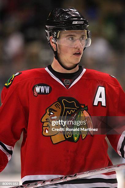 Jonathan Toews of the Chicago Blackhawks looks on during a break in NHL game action against the Dallas Stars at the American Airlines Center on...