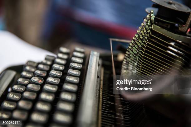 The key tops and typebars of a typewriter are seen in Yangon, Myanmar, on Thursday, June 15, 2017. A pariah state for decades, Myanmars recent...