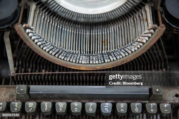 The key tops and typebars of a typewriter are seen in Yangon, Myanmar, on Thursday, June 15, 2017. A pariah state for decades, Myanmars recent...