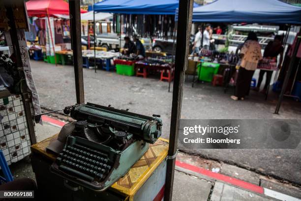 Typewriter sits on a table at a street stall in Yangon, Myanmar, on Friday, June 16, 2017. A pariah state for decades, Myanmars recent emergence from...