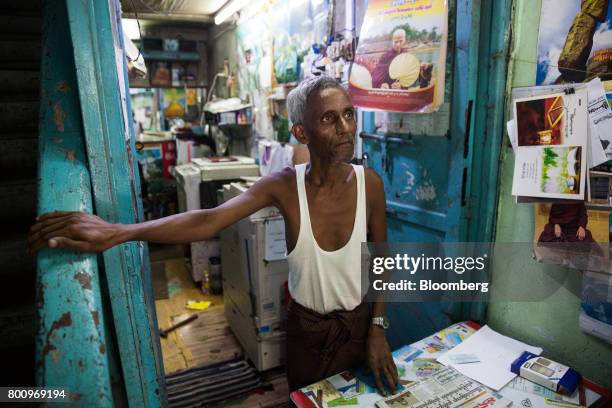 Typist and repairman stands for a photograph at a shop in Yangon, Myanmar, on Thursday, June 15, 2017. A pariah state for decades, Myanmars recent...