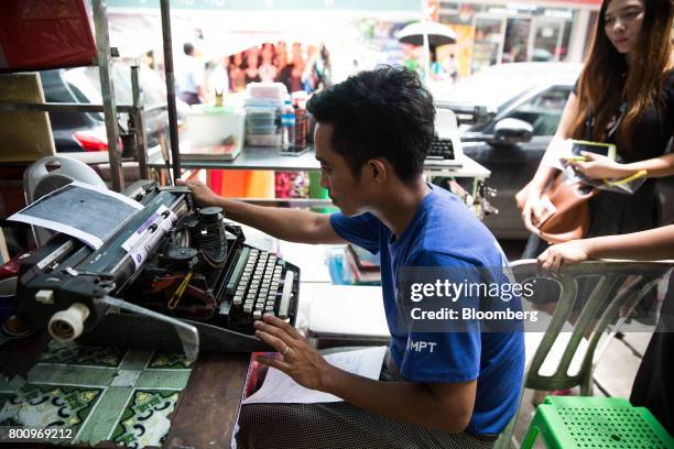 Typist works on a typewriter in Yangon, Myanmar, on Thursday, June 15, 2017. A pariah state for decades, Myanmars recent emergence from economic...