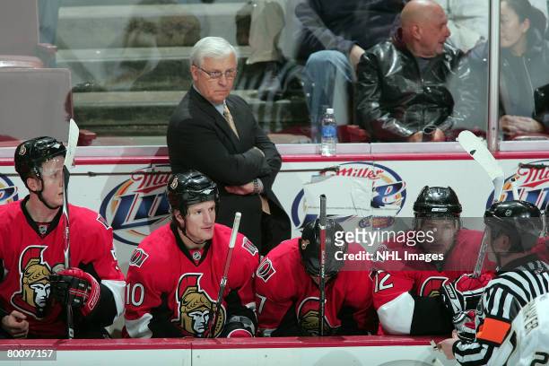 Bryan Murray, Head Coach and General Manager of Ottawa Senators, listens to an explanation of a call from the referee against the Anaheim Ducks at...