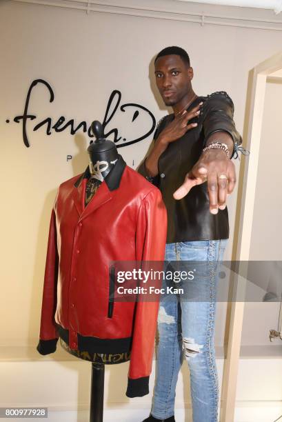 French professional basketball player for the Washington Wizards Ian Manhinmi poses during the French Deal Cocktail as part of Paris Fashion Week on...