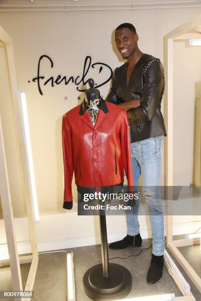 French professional basketball player for the Washington Wizards Ian Manhinmi poses during the French Deal Cocktail as part of Paris Fashion Week on...
