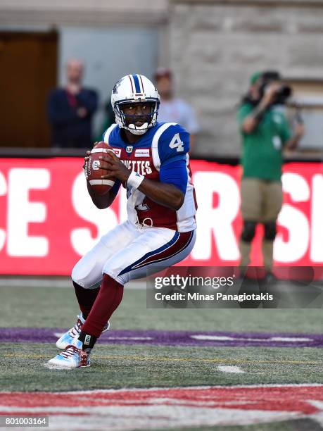 Quarterback Darian Durant of the Montreal Alouettes looks to play the ball against the Saskatchewan Roughriders during the CFL game at Percival...