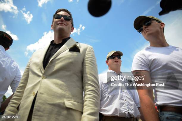 Surrounded by his bodyguards, Alt-Right leader Richard Spencer answers questions of reporters during a rally at the Lincoln Memorial in Washington,...