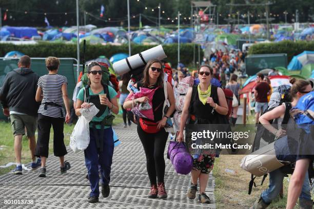 Festival goers leave the Glastonbury Festival site at Worthy Farm in Pilton on June 26, 2017 near Glastonbury, England. Glastonbury Festival of...