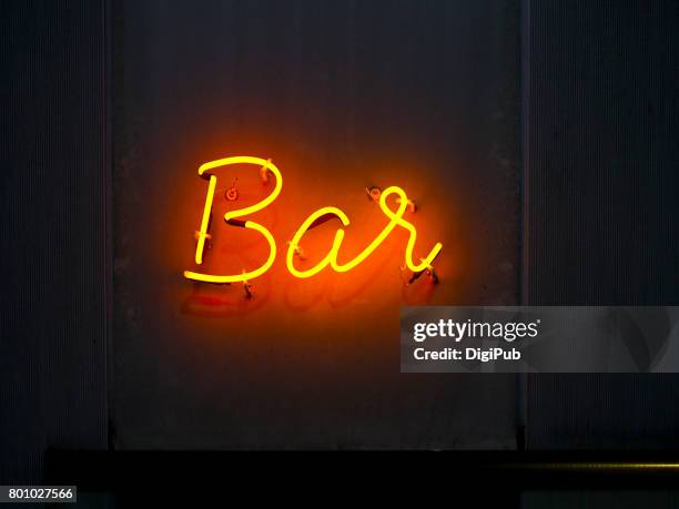 'bar' neon sign on the wall in the night - neon sign ストックフォトと画像