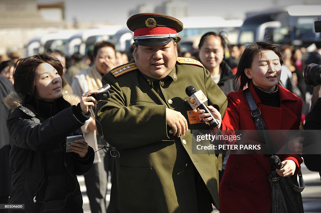 A People's Liberation Army soldier and d