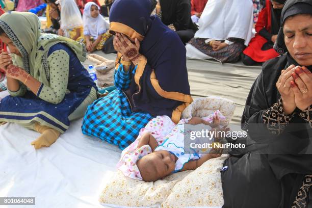 Baby is seen amid the Sri Lankan mulim women attending the Eid al-Fitr prayers to mark the end of the holy fasting month of Ramadan in Colombo, Sri...