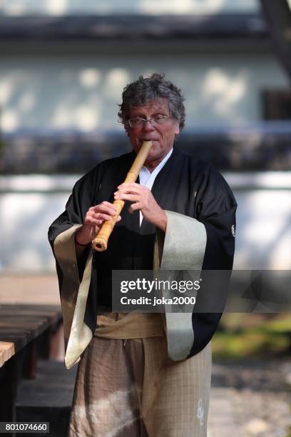 playing shakuhachi - shakuhachi flute imagens e fotografias de stock