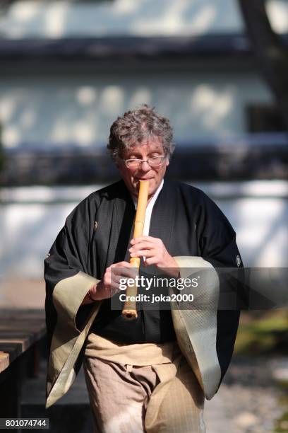 playing shakuhachi - shakuhachi flute imagens e fotografias de stock