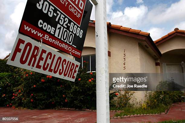 Foreclosure sign hangs in front of a home March 4, 2008 in Miami, Florida. Federal Reserve Chairman Ben Bernanke called for additional action to help...