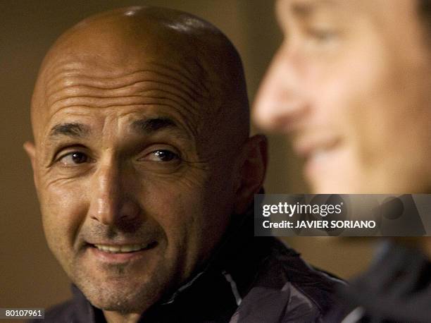 Roma's coach Luciano Spalletti and captain Francesco Totti take part in a press conference on the eve of a Champions League return leg football match...