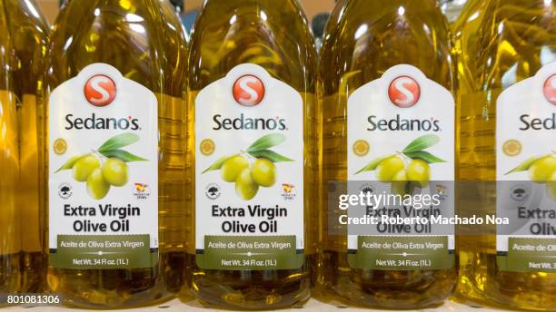 Sedanos Extra Virgin Olive Oil. Row of one liter plastic bottles of Sedano's extra virgin olive oil on display in a store.